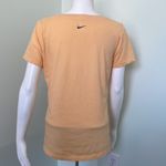 Nike  Women’s Dri-FIT Script-Logo Orange Scoop Neck Training T-Shirt Medium Photo 2