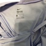 Nike Pro Essential Swoosh Tank
Color Light purple and Black size medium Photo 3