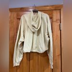 Divided  women’s cropped hoodie with drawstring on the bottom Photo 1