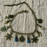 Charming Gold Bracelet with Blue and Cream Accents Photo 1