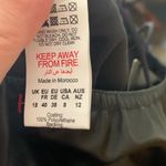 Pretty Little Thing  black strappy split hem flare jumpsuit‎ Photo 7