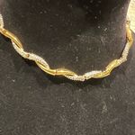 FO Fernando Original stamped vintage necklace sits at the base of neckline Gold Photo 1