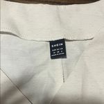 SheIn Off-White Sleeveless Blouse with Statement Buttons Photo 1