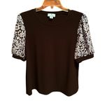 CeCe  Black Top with Floral Sleeves Photo 0