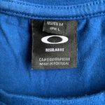 Oakley size medium cropped long sleeve blue T-shirt Photo 2