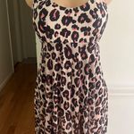 Generic Stylish leopard print swim dress with black underlay. Perfect for beach outings. Photo 2