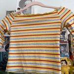 yellow, red, and grey striped off Photo 1