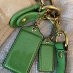 Coach  hobo-style crossbody purse, beige signature with green leather trim. Photo 5