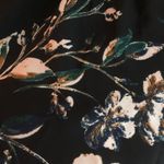 A pea in the pod  size small Black floral top Photo 1