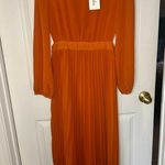 NWT women’s orange long sleeve, open sides dress Photo 0
