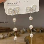 Hollow Bow Shiny Zircon Dangle Earrings White Photo 3