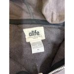 alife dark gray full Zip hoodie with hot pink logo with polka dots. Size M Size M Photo 3