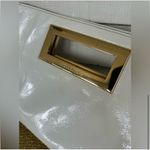 Michael Kors Glossy White Berkeley Clutch Purse with Gold Accent Photo 1