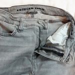 American Eagle  Next Level Stretch High Rise Light Gray Denim Distressed Jeans 0 Photo 4