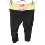 Lululemon  4 Black Reversible Wunder Under Crop Leggings Flowabynga Yellow Coral Photo 3