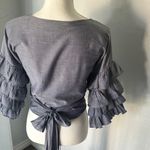 Haute Monde Ruffle Wrap Blouse — Bold Sleeves, Luxe Texture. Photo 3