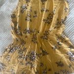 Brandy Melville Yellow Floral Romper Photo 0
