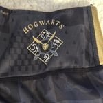 Warner Bros Black and Gold Leggings with Tapered Design Size XS Photo 2