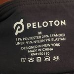 Peloton  Women’s Black Logo Sports Bra with Colorful Criss Cross Straps Active Photo 6