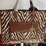Caitina Brown and Cream Zebra Crossbody Bag w/ purse charm Photo 0