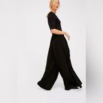 Free People  Beach Black Rosebowl Jumpsuit Size Medium Photo 1