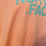 The North Face Neon Orange With Teal Logo Graphic Size XL Hooded Sweatshirt. Photo 3