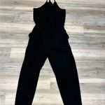 Black Jumper Size Large, adjustable straps and waist out to pit 20, inseam 28 Photo 3