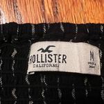 Navy blue cropped shirts with some white stripes size small. Black Size M Photo 2