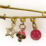 Charming Gold Safety Pin with Fun Charms Photo 0