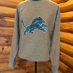 NFL Detroit lions sweater! Gray Sweatshirt with Blue Glitter Logo! Size large Photo 3