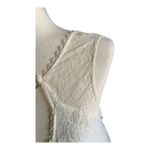 Free People -DONT YOU DARE Stunning cream color lace dress, sleeveless, lined, front keyhole opening, V back, skirt has some gold shimmer, excellent condition, size XS Measurements: Bust: armpit to armpit 15 inches Length: shoulder seam to bottom 33 inches Photo 4