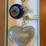 Eye Candy  Los Angeles, Greek evil eye, and heart bag charm Photo 1