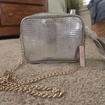 Victoria's Secret Victoria Secret purse/elegant bag. New with tags. Purse is silver. Strap is gold Photo 0