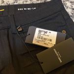 Saint Laurent  Cropped Raw Edge Boot Cut Denim Pants Photo 6