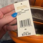 Michael Kors  mini orange backpack  Photo 2
