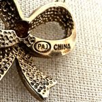 PAJ Silver and gold Tone Textured Bow Pendant Necklace Photo 6