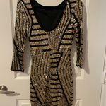 Windsor Black And Gold Sequined Homecoming Dress Photo 1