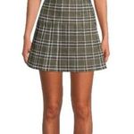 No Boundaries Super cute green plaid pleated skirt, side zipper, like new condition. Size 11/13 Measurements: Waist: side to side 16 inches  Length: waistband to bottom 16 inches Photo 0