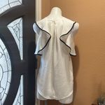 Q&A  beige and black flowy top Photo 4