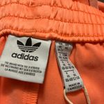 Adidas Women’s  sprinter shorts in semi coral! NWT 3 Strip Size XL Photo 4