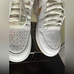 Nike White and Metallic Gold Air Jordan 1 Retro Sneakers Photo 3