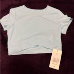 Halara 028HA.- SoftlyZero™ Plush Crossover Hem Cropped Sports Top. Photo 0