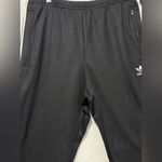 Adidas  unisex Black Joggers with White Stripes Photo 4
