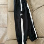 Nike Women's Sportswear Repel Essential Woven Jogger Pants Photo 14