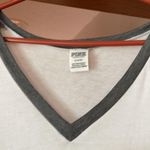 PINK - Victoria's Secret PINK Medium White  v neck short sleeve t shirt with grey PINK on sleeves Photo 1