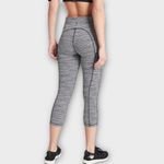 Athleta Ultimate Linear Lines Capri Leggings Women's XS Black White Pockets Photo 1