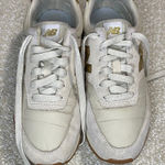 New Balance  Women's Cream and Gold Athletic Shoes Photo 0