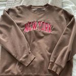 Brandy Melville brown and red sweatshirt Photo 0