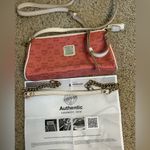 MCM  mini purse also comes with a crossbody strap Photo 6