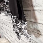 Kirkland Signature Elegant Black Floral Hem top with cold‎ shoulder embroidered flower shape cutout Photo 3